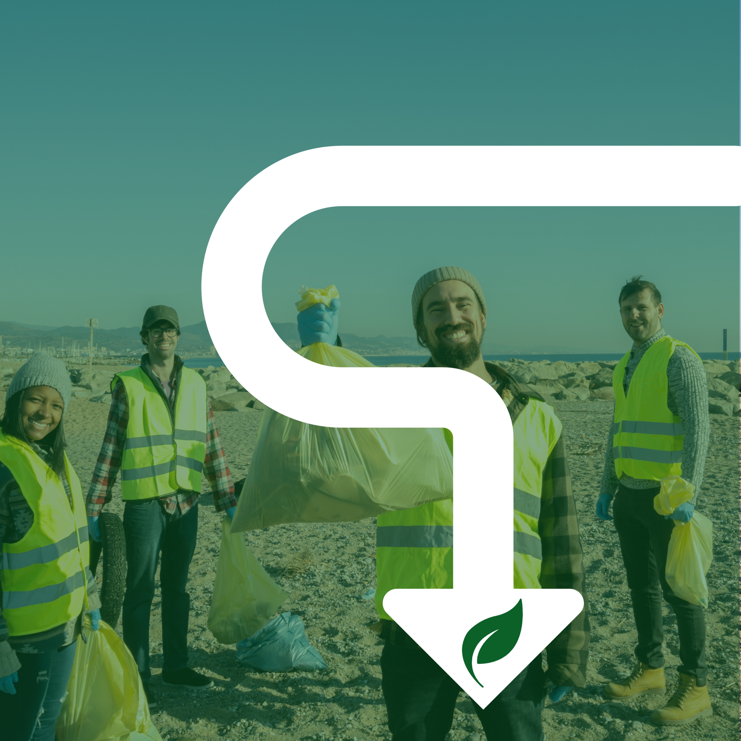 A group of people wearing safety vests on a beach cleaning plastic waste from the sand. There is a man in the front holding up a full bag of waste and smiling. A white arrow pointing down with a leaf in the center.