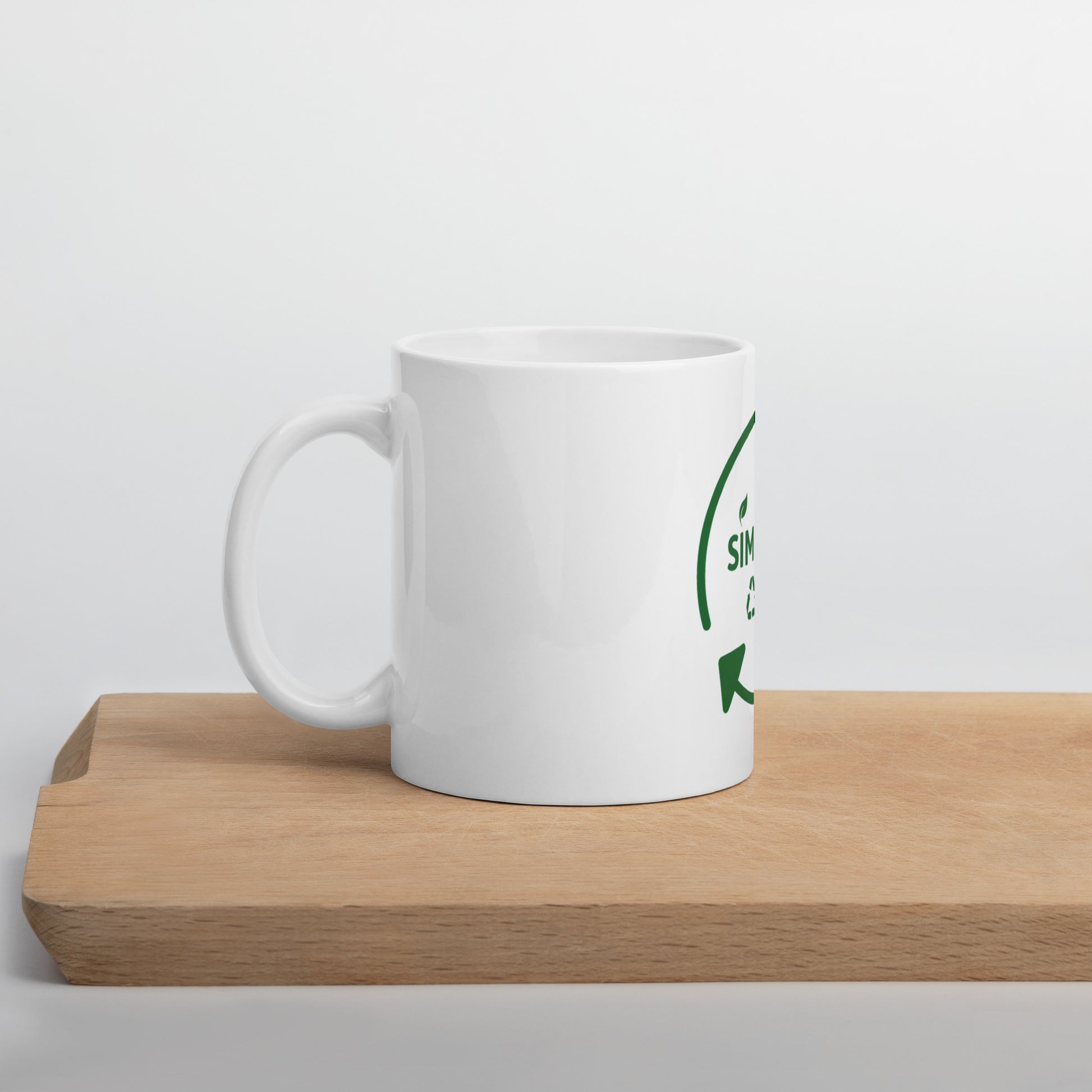 SimpleCycle White Glossy Mug on a cutting board