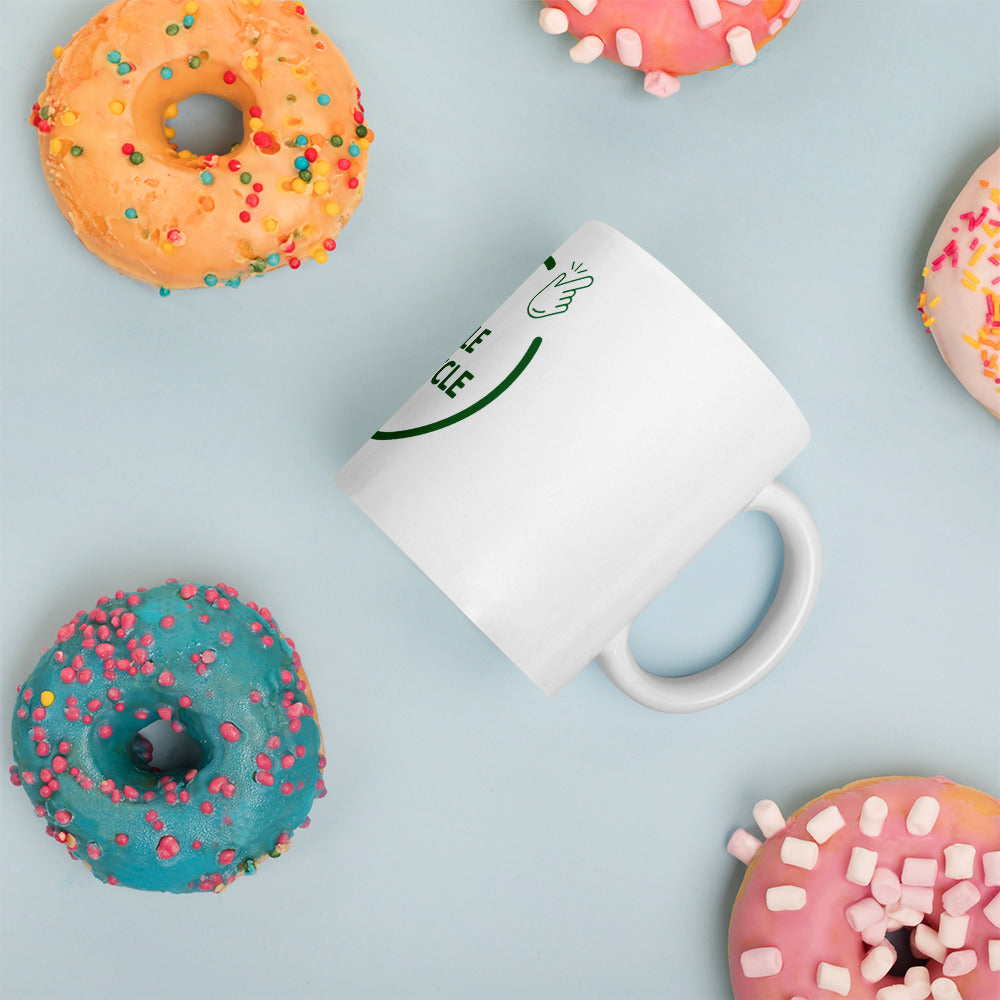 SimpleCycle White Glossy Mug side view with donuts